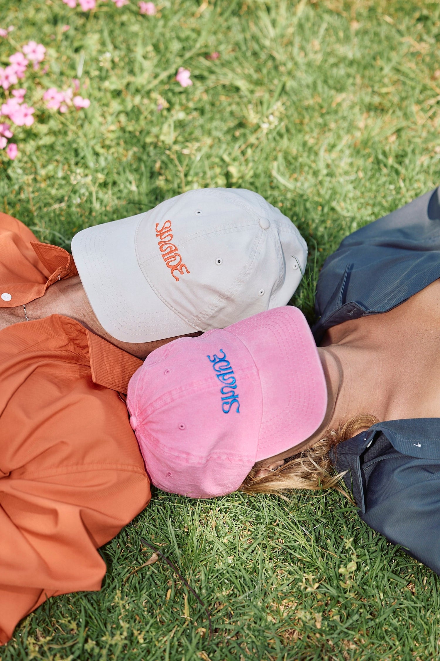 A sun smart couple wear the Sun Ray UPF50+ Sun Protection Clothing Long Sleeve Shirt and Shade Cap at a picnic in Australia.